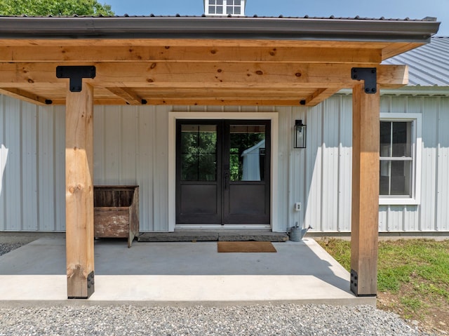 376 Rte 165, Preston, CT 06365 - entrance to property featuring french doors, a metal roof, and board and batten siding