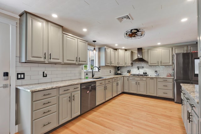 1028 Mountain Rd, Suffield, CT 06093 - kitchen featuring wall chimney range hood, stainless steel appliances, tasteful backsplash, light wood finished floors, and recessed lighting