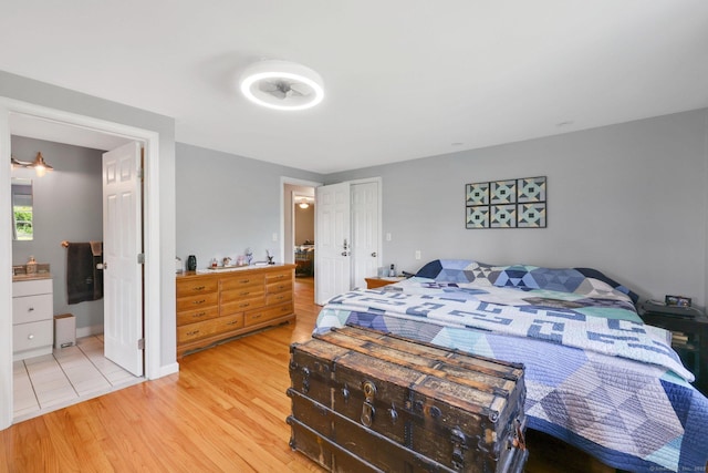 1028 Mountain Rd, Suffield, CT 06093 - bedroom with light wood-type flooring and ensuite bathroom