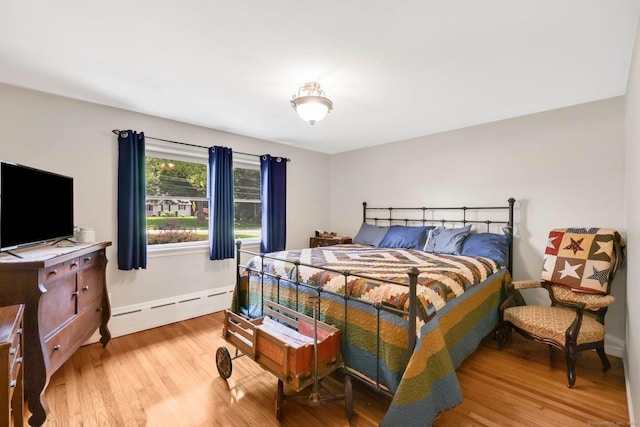 1028 Mountain Rd, Suffield, CT 06093 - bedroom with a baseboard radiator and wood finished floors