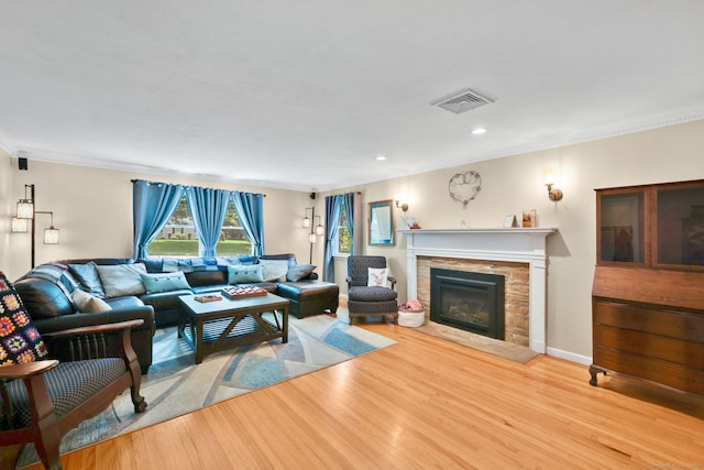 1028 Mountain Rd, Suffield, CT 06093 - living area with wood finished floors, a fireplace, ornamental molding, and recessed lighting