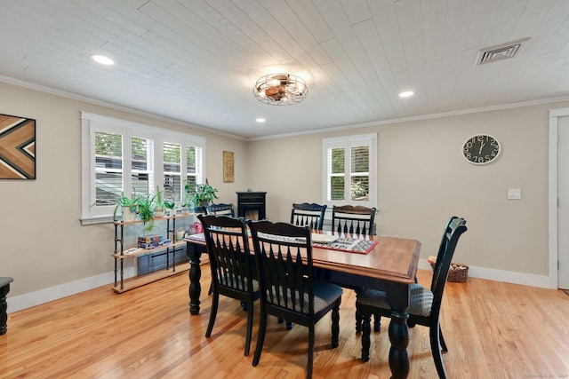 1028 Mountain Rd, Suffield, CT 06093 - dining area with light wood finished floors, crown molding, and recessed lighting