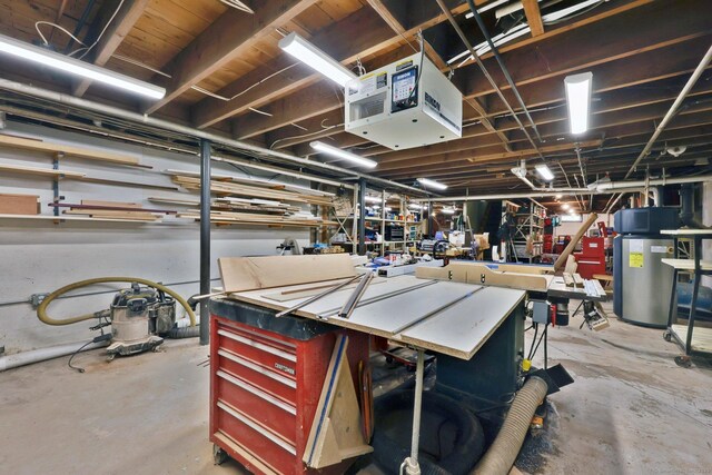 1028 Mountain Rd, Suffield, CT 06093 - unfinished below grade area with a workshop area, water heater, and a heating unit