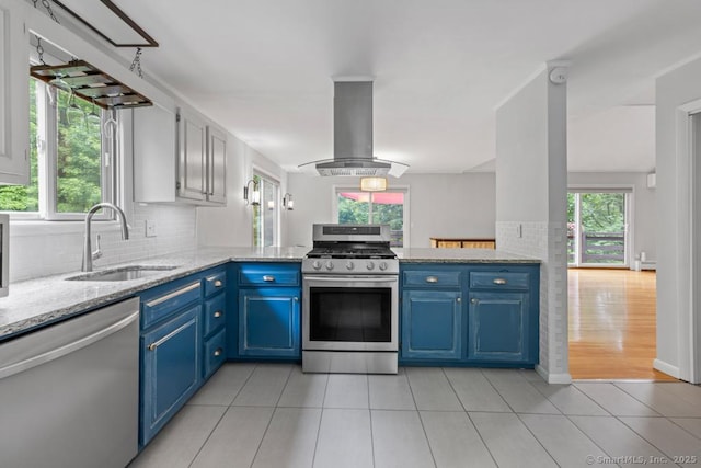 96 Pine Mountain Rd, Ridgefield, CT 06877 - kitchen featuring appliances with stainless steel finishes, island exhaust hood, blue cabinetry, and light tile patterned flooring