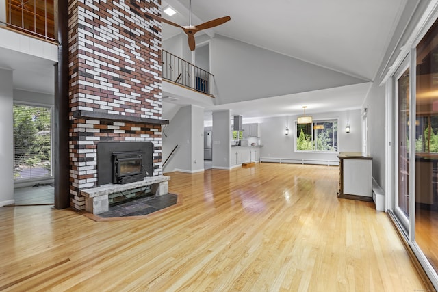 96 Pine Mountain Rd, Ridgefield, CT 06877 - unfurnished living room featuring high vaulted ceiling, light wood-type flooring, ceiling fan, and a baseboard heating unit