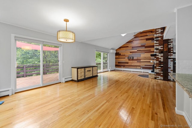 96 Pine Mountain Rd, Ridgefield, CT 06877 - unfurnished living room with baseboard heating, wood finished floors, a skylight, lofted ceiling, and wood walls