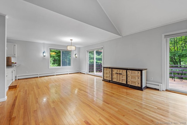 96 Pine Mountain Rd, Ridgefield, CT 06877 - unfurnished living room with baseboard heating, a baseboard heating unit, light wood finished floors, and vaulted ceiling