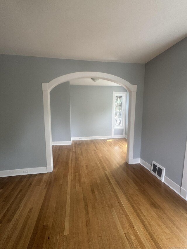 18 Pine St, Waterbury, CT 06710 - spare room with arched walkways and wood finished floors