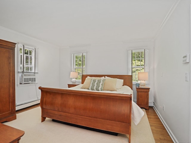 5 September Ln, Weston, CT 06883 - bedroom featuring baseboard heating, crown molding, light wood-style flooring, and cooling unit