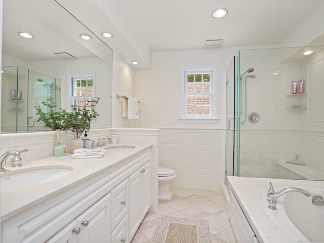 5 September Ln, Weston, CT 06883 - bathroom with recessed lighting, double vanity, a stall shower, a bath, and tile walls