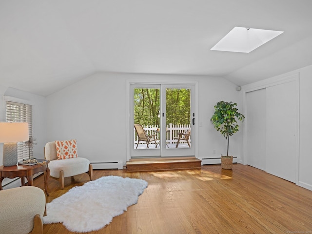 5 September Ln, Weston, CT 06883 - sitting room featuring lofted ceiling, a skylight, baseboard heating, and wood finished floors