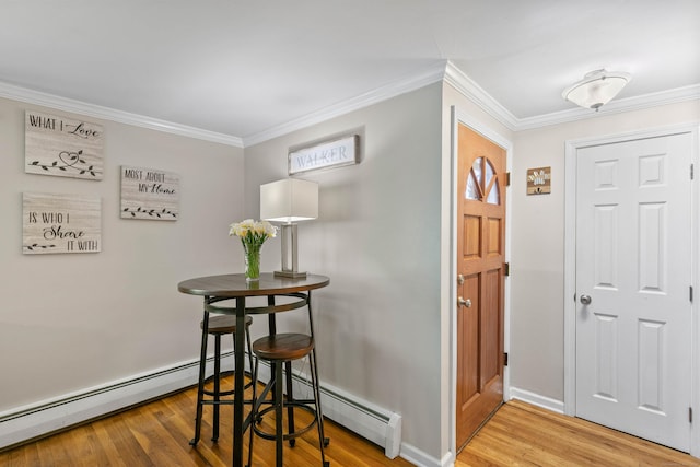 50 Carroll Rd, Hamden, CT 06517 - foyer entrance with wood finished floors, crown molding, and a baseboard heating unit