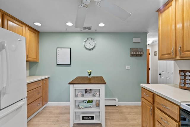 50 Carroll Rd, Hamden, CT 06517 - kitchen with freestanding refrigerator, a baseboard heating unit, light countertops, and recessed lighting