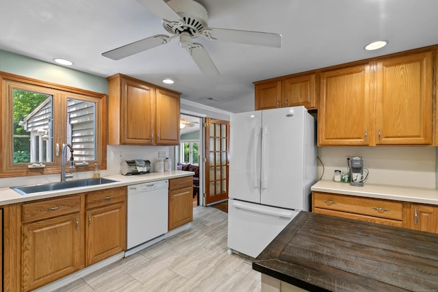 50 Carroll Rd, Hamden, CT 06517 - kitchen featuring white appliances, plenty of natural light, ceiling fan, brown cabinets, and recessed lighting