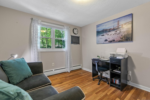 50 Carroll Rd, Hamden, CT 06517 - office with wood finished floors, baseboard heating, and a textured ceiling