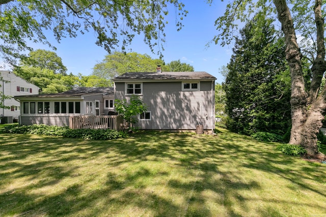 50 Carroll Rd, Hamden, CT 06517 - rear view of house with a chimney, a lawn, and a deck
