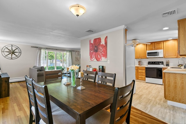 50 Carroll Rd, Hamden, CT 06517 - dining space featuring a baseboard heating unit, ornamental molding, light wood-type flooring, and a ceiling fan