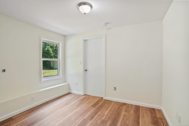 1198 New Haven Ave, Milford, CT 06460 - unfurnished room with light wood-type flooring and a smoke detector