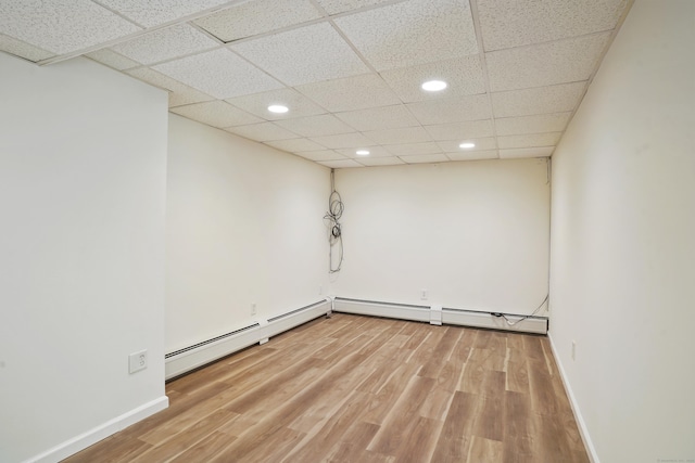 1198 New Haven Ave, Milford, CT 06460 - unfurnished room featuring baseboard heating, recessed lighting, wood finished floors, and a paneled ceiling