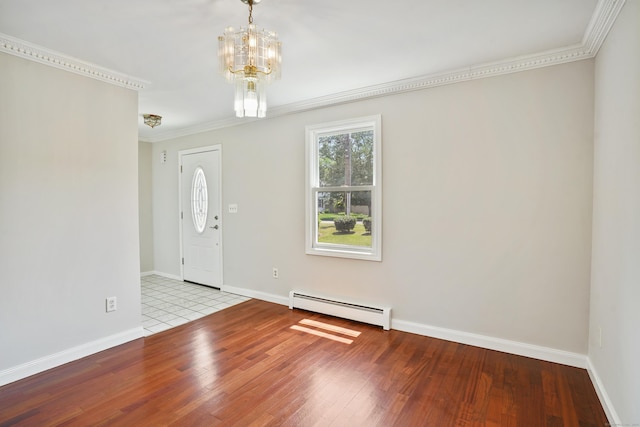 1198 New Haven Ave, Milford, CT 06460 - foyer with a baseboard radiator, ornamental molding, wood finished floors, and a chandelier