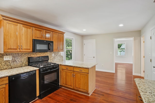1198 New Haven Ave, Milford, CT 06460 - kitchen with black appliances, a peninsula, backsplash, dark wood finished floors, and plenty of natural light