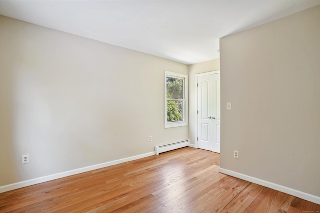 1198 New Haven Ave, Milford, CT 06460 - spare room featuring a baseboard radiator and light wood-type flooring
