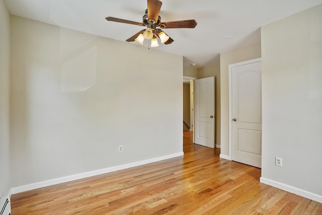1198 New Haven Ave, Milford, CT 06460 - spare room with a ceiling fan, light wood finished floors, and a baseboard heating unit