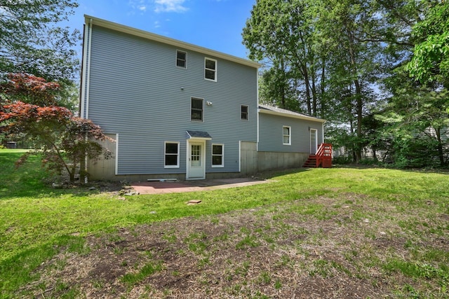 1198 New Haven Ave, Milford, CT 06460 - rear view of property featuring a lawn and a patio area