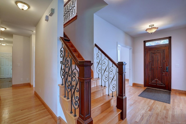 125 Waverly Dr, Newington, CT 06111 - foyer featuring light wood-style flooring and stairs