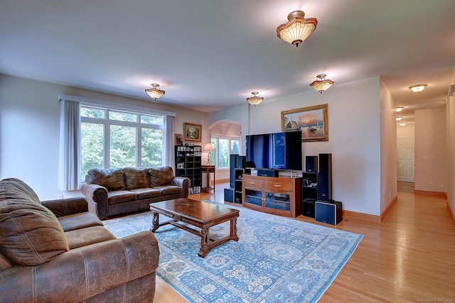 125 Waverly Dr, Newington, CT 06111 - living area with arched walkways and light wood finished floors