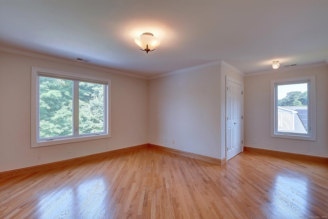125 Waverly Dr, Newington, CT 06111 - spare room featuring light wood-style flooring and crown molding