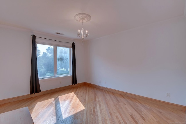 125 Waverly Dr, Newington, CT 06111 - empty room with a chandelier and light wood finished floors