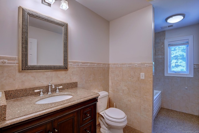 125 Waverly Dr, Newington, CT 06111 - bathroom with tile walls, vanity, a tub, and a wainscoted wall