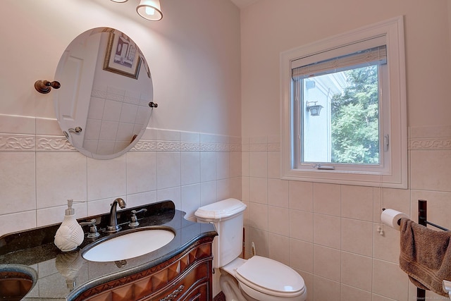 125 Waverly Dr, Newington, CT 06111 - bathroom with tile walls, vanity, and a wainscoted wall