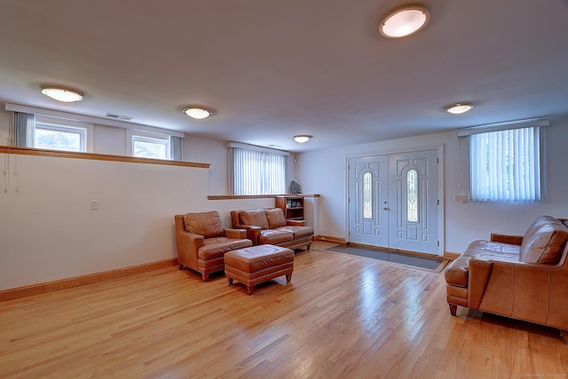 125 Waverly Dr, Newington, CT 06111 - living area featuring light wood-style floors and baseboards