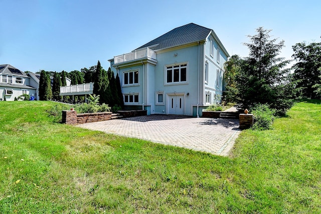 125 Waverly Dr, Newington, CT 06111 - back of property featuring a patio area, a balcony, stucco siding, and a yard