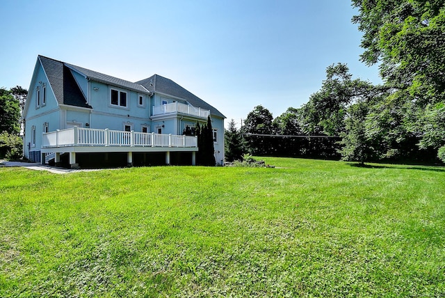 125 Waverly Dr, Newington, CT 06111 - back of house with a lawn, roof with shingles, and a balcony