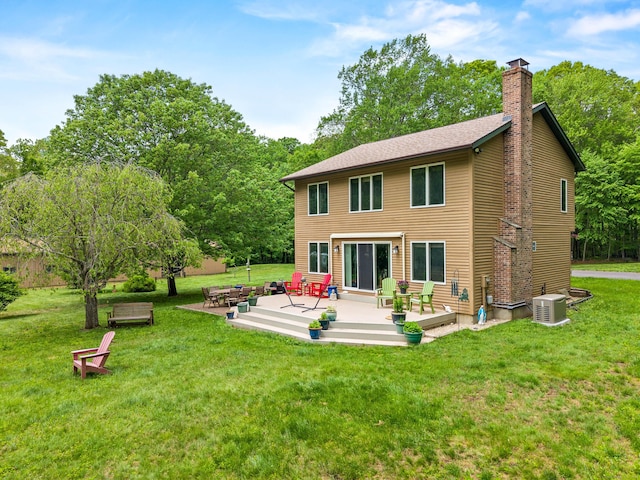 115 Town Farm Rd, East Haddam, CT 06423 - rear view of property with a chimney, a patio, and a yard