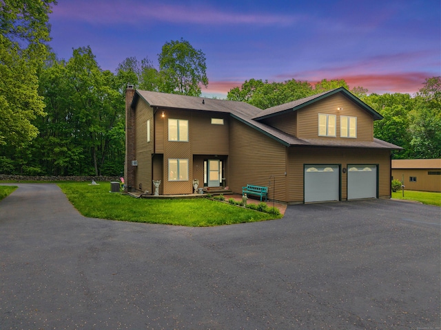 115 Town Farm Rd, East Haddam, CT 06423 - view of front of property with driveway, a chimney, an attached garage, and a yard
