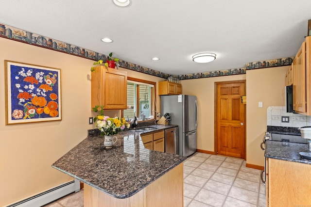 115 Town Farm Rd, East Haddam, CT 06423 - kitchen with a baseboard heating unit, a peninsula, stainless steel appliances, dark stone countertops, and recessed lighting