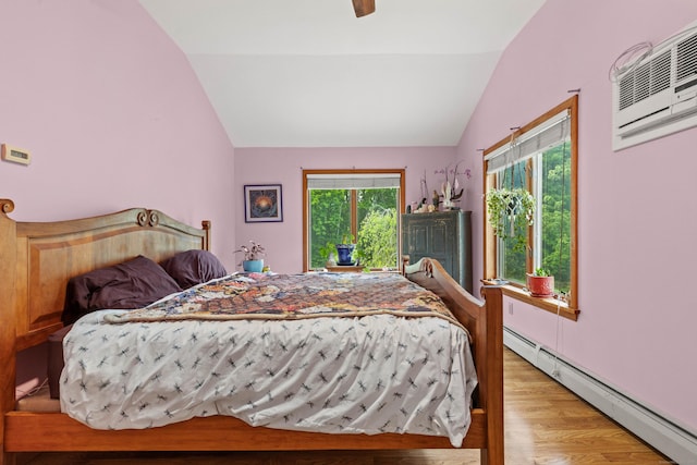 115 Town Farm Rd, East Haddam, CT 06423 - bedroom featuring a baseboard heating unit, vaulted ceiling, wood finished floors, a wall mounted air conditioner, and ceiling fan