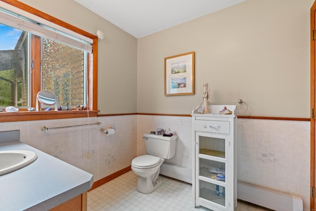115 Town Farm Rd, East Haddam, CT 06423 - bathroom featuring tile walls, vanity, a wainscoted wall, and baseboard heating