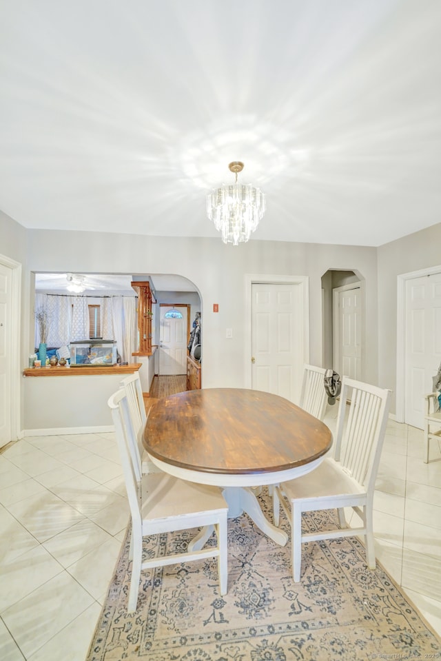 350 S Main St, Naugatuck, CT 06770 - dining space with arched walkways, light tile patterned floors, and a chandelier