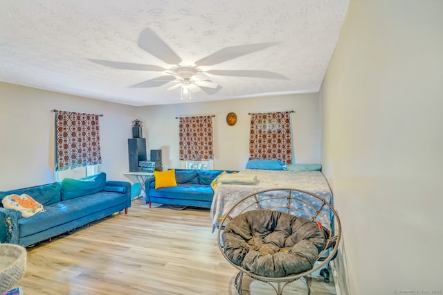 350 S Main St, Naugatuck, CT 06770 - living area featuring wood finished floors, a textured ceiling, and ceiling fan