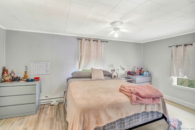350 S Main St, Naugatuck, CT 06770 - bedroom with a baseboard heating unit, light wood-style flooring, crown molding, and a ceiling fan