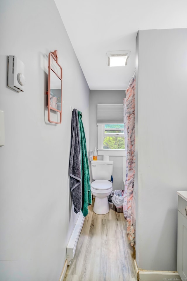 350 S Main St, Naugatuck, CT 06770 - bathroom with wood finished floors, vanity, and a shower with shower curtain