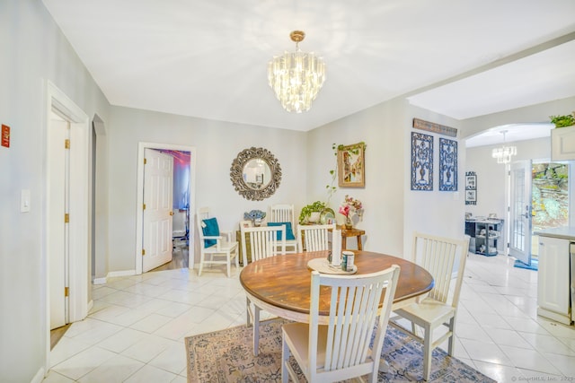 350 S Main St, Naugatuck, CT 06770 - dining space with a chandelier, light tile patterned flooring, and arched walkways