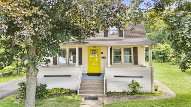 27 Homestead St, Manchester, CT 06042 - view of front of house with a front yard and a shingled roof