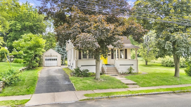27 Homestead St, Manchester, CT 06042 - view of front of home featuring an outdoor structure, a detached garage, a front lawn, driveway, and a porch