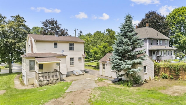 27 Homestead St, Manchester, CT 06042 - rear view of property with a lawn, a chimney, and a wooden deck